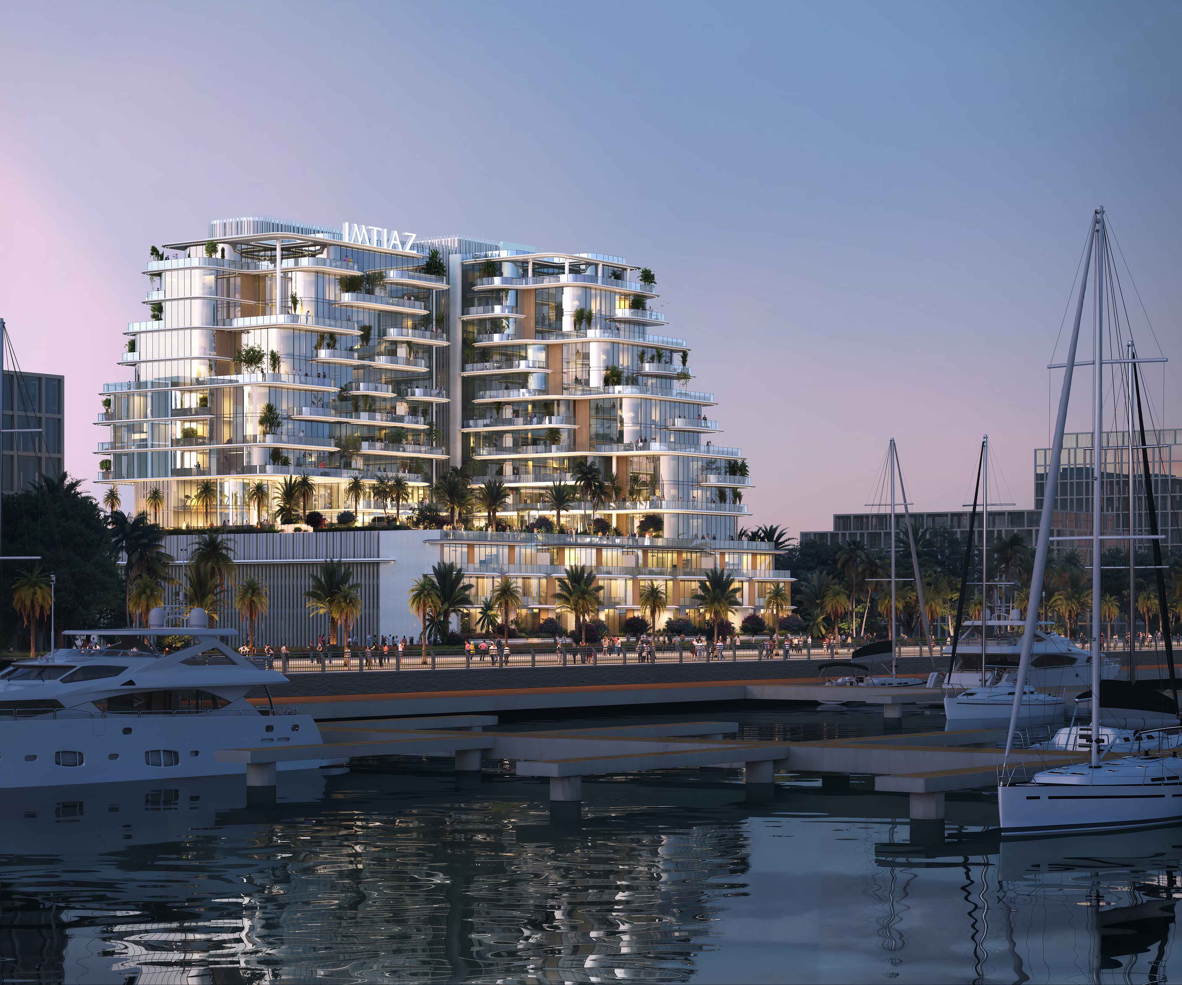 Cotier House 2 By Imtiaz A modern waterfront building with balconies and palm trees, reflecting on water, surrounded by boats at dusk.